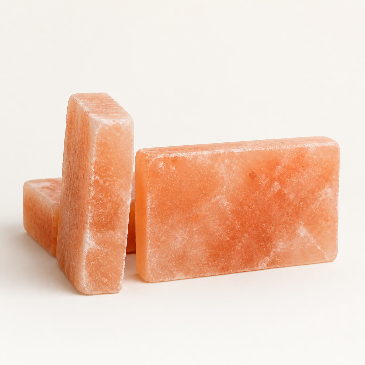 Himalayan salt tiles showing the 8 by 4 inch face and the cut thickness